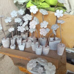 Metal Blossoms in a World of Hands